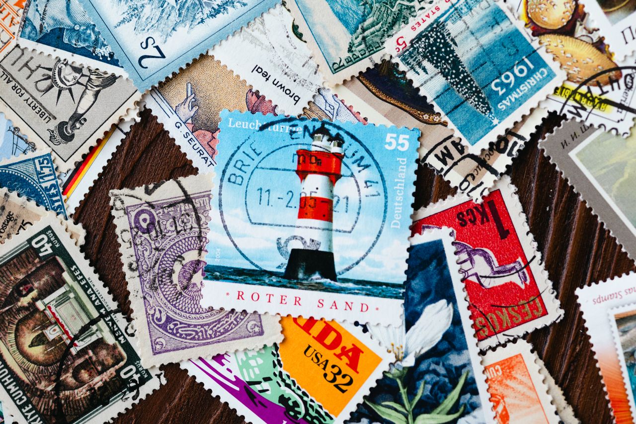 A vibrant assortment of international vintage postage stamps, highlighting various designs and histories.